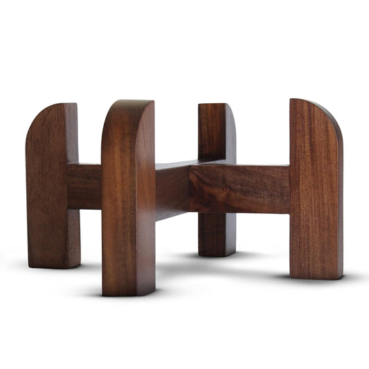 Handmade solid teak wood stand with a curved design, with a dark brown finish.Handcrafted teak wood stand designed for the Phoenix gravity water filter.